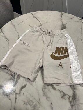 Nike Men’s Cream Athletic Shorts with Brown Logo